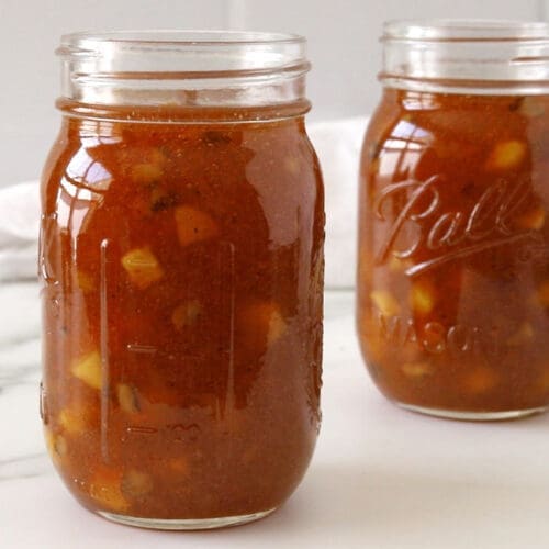 Two mason jars filled with carrot cake jam.