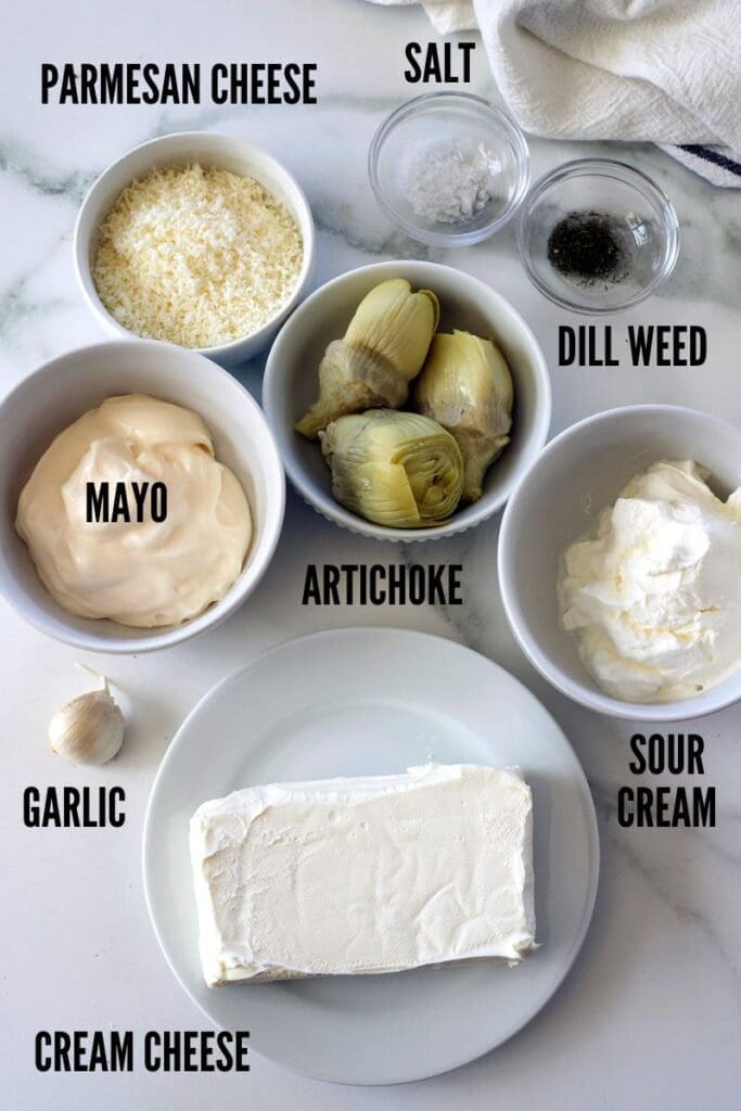 Labeled photo showing the ingredients to make artichoke dip.