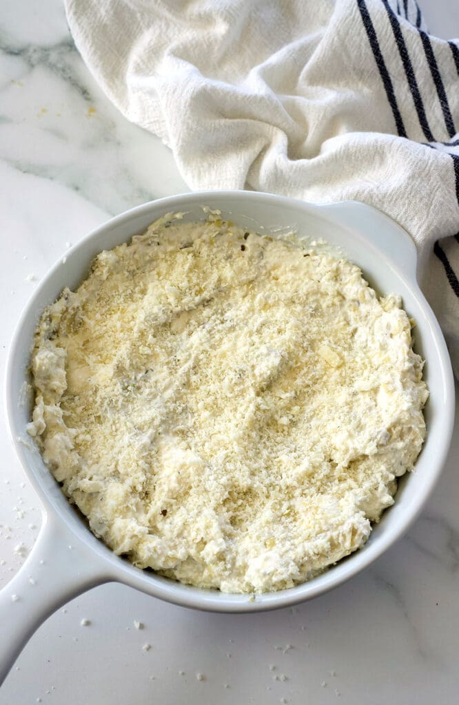 white baking dish with a cheese appetizer inside.