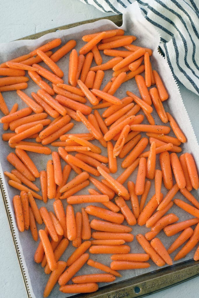 Baking sheet full of roasted carrots.