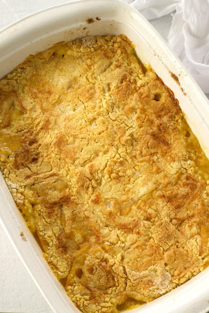 Cooked dessert in a white baking pan.