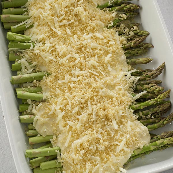 Cheese and panko on top of asparagus.