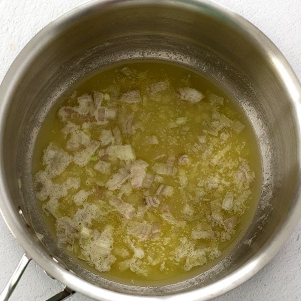 Silver saucepan with butter.