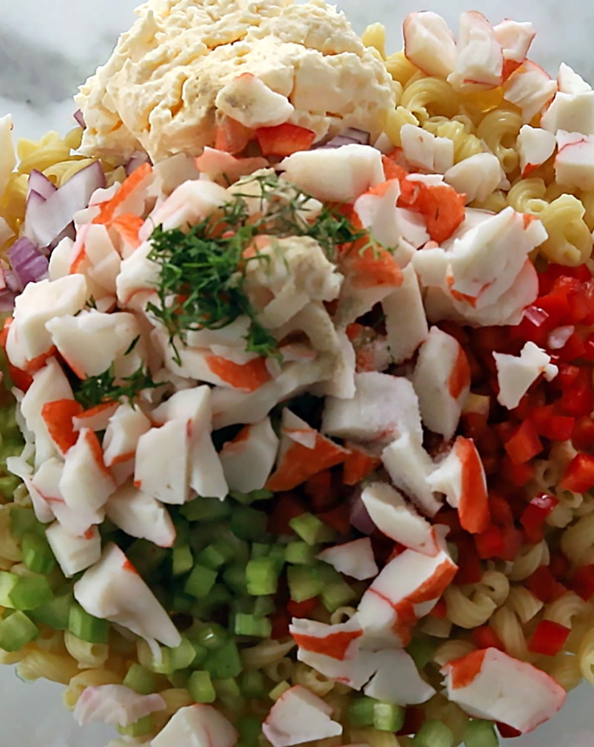 Photos of pasta, crab and vegetables.