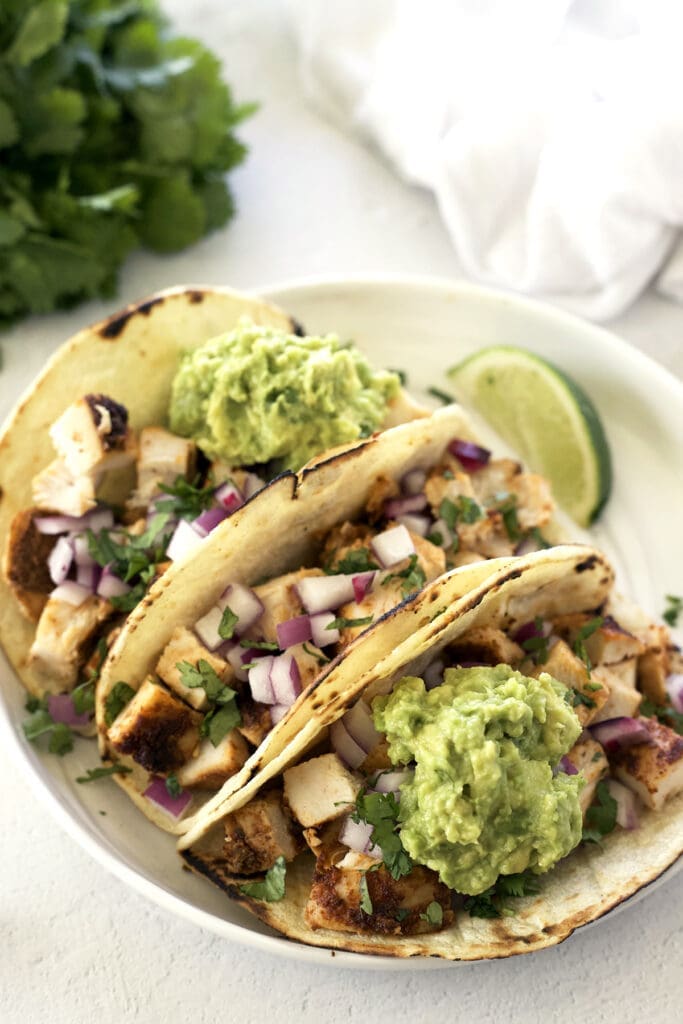 Plate of chicken tacos for 4th of July Mexican food article.