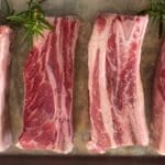 Four raw short ribs for best cuts of beef for slow cooking article.