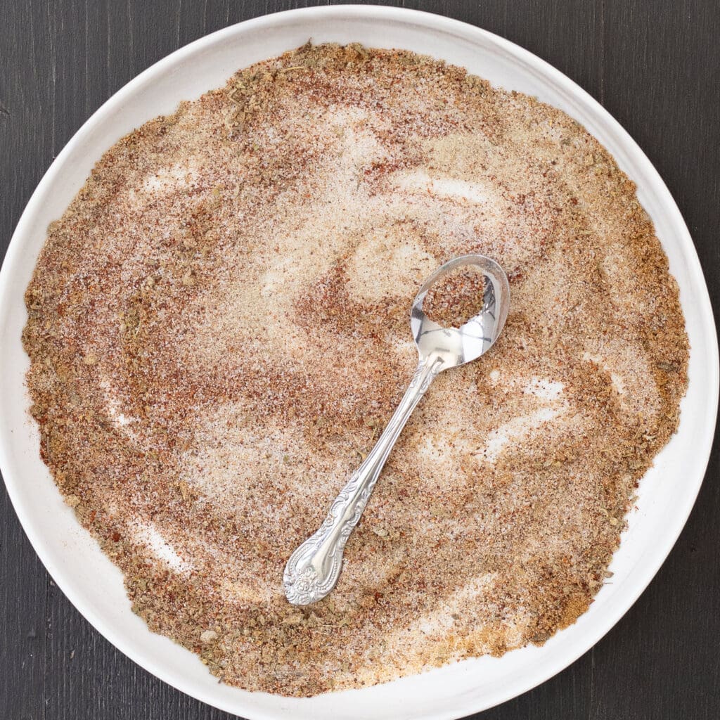 plate of carne asada rub with spoon.