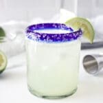 Margarita Mix and Lime in a blue cobalt and clear glass.