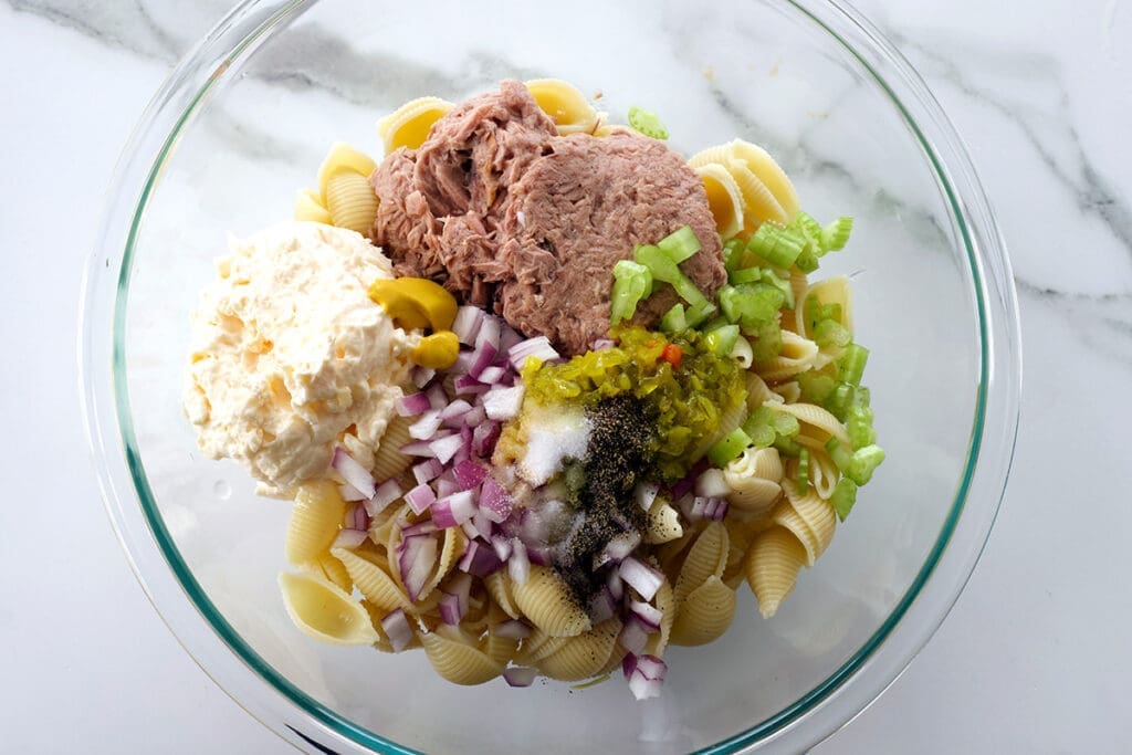 Bowl of ingredients to make tuna macaroni salad.