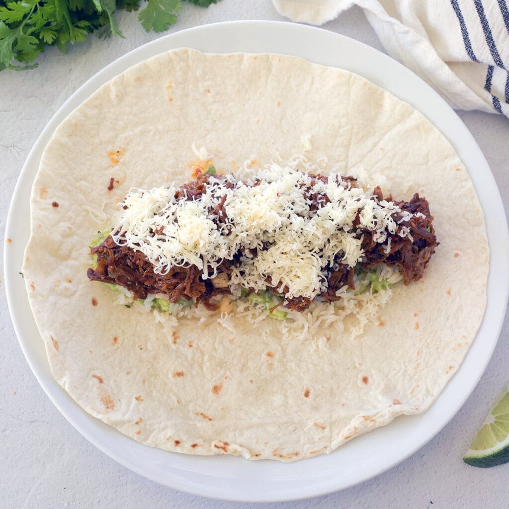 Flour tortilla with fillings in the middle.